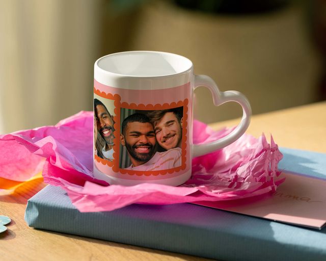A personalised heart-shaped handle mug with photos of a couple on it.