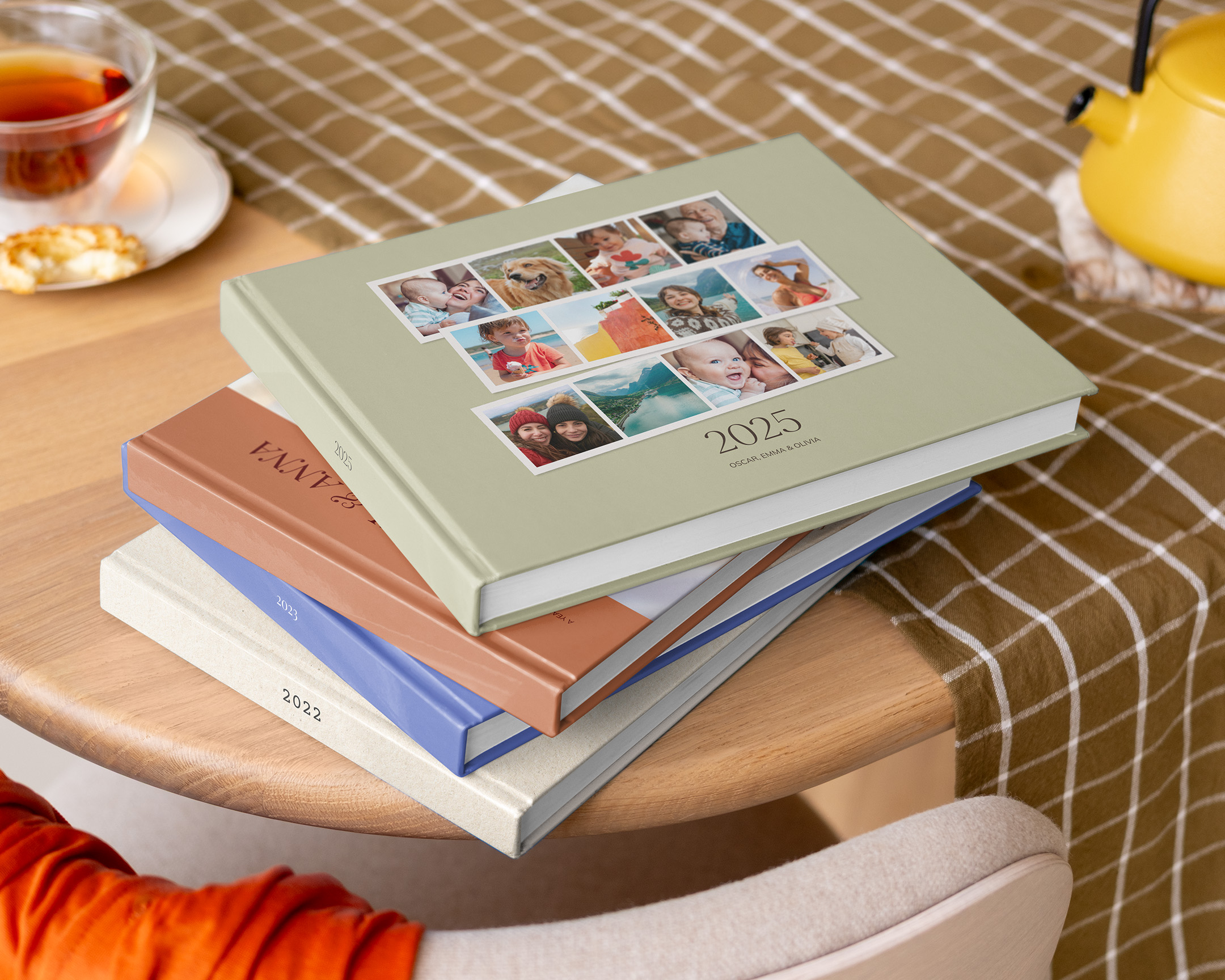 Stack of personalised photo books on a table