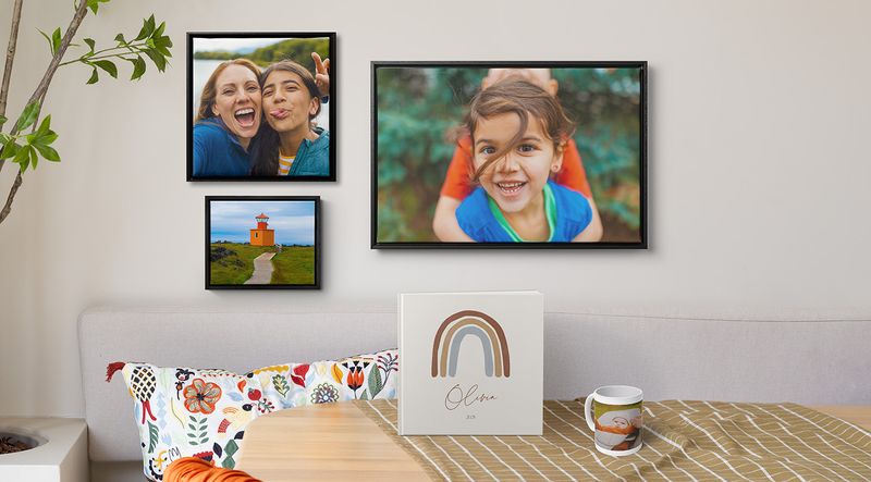 Living area with framed wall art, photo book and mug