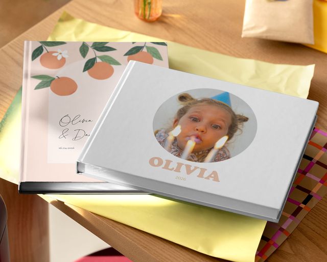 A table with a couple of photo books on it.